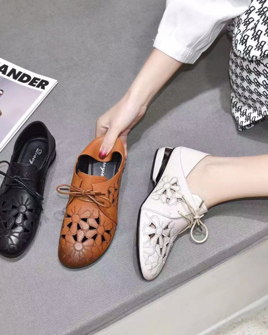 Round -headed single shoe women's spring and summer head layer cowhide hollow flowers light mouth single shoes are leaving flat shoes