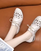 Round -headed single shoe women's spring and summer head layer cowhide hollow flowers light mouth single shoes are leaving flat shoes